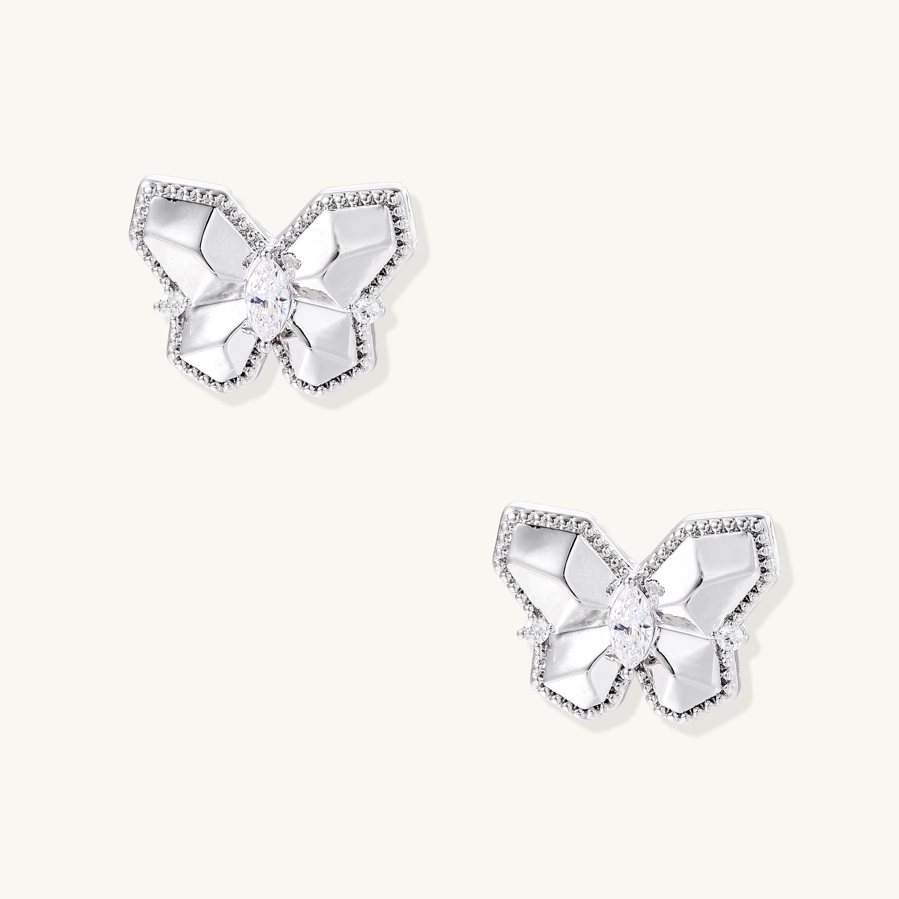 Delicate gold-plated butterfly stud earrings with zirconia crystals outlining wings and marquise center stones