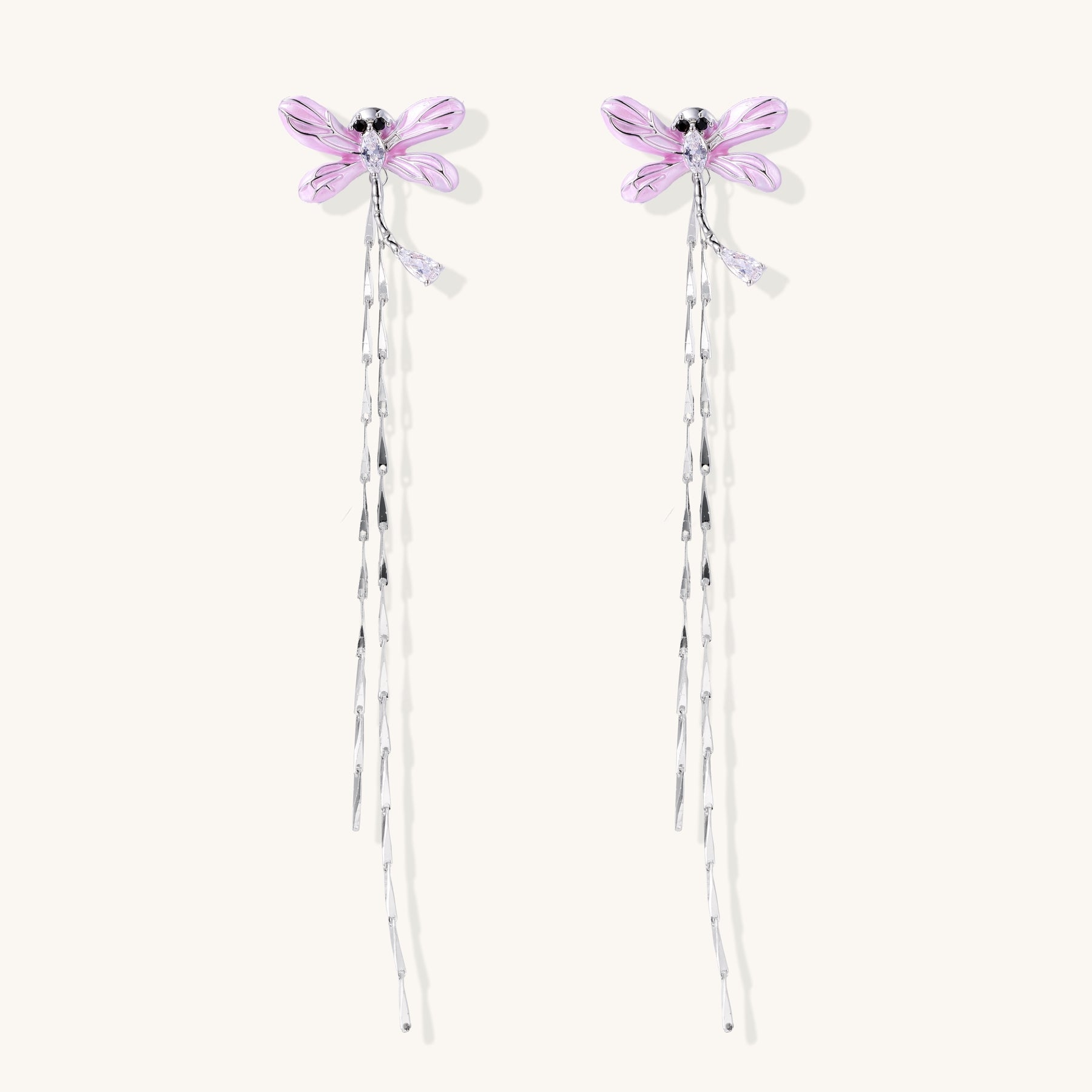 Long dangle earrings with purple dragonfly charms and crystal chains on white background, gold-plated finish.