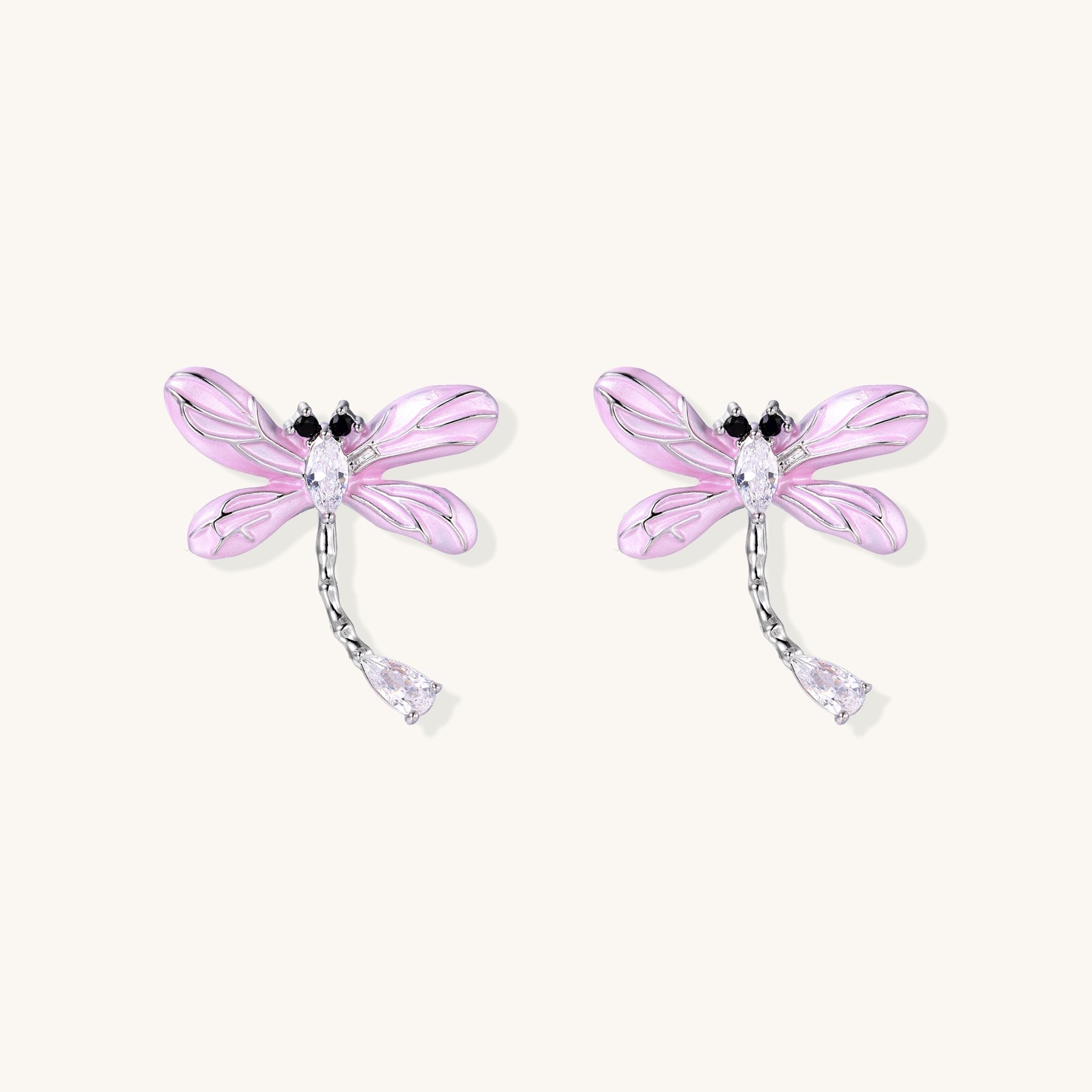 Long dangle earrings with purple dragonfly charms and crystal chains on white background, gold-plated finish.